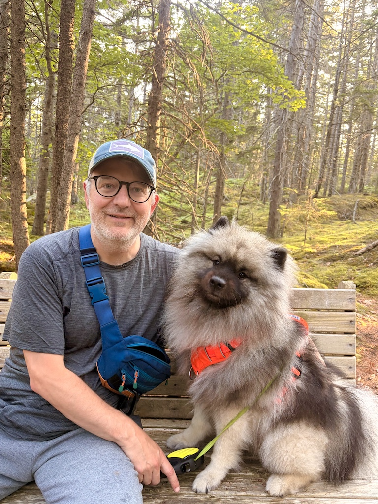 Owen Clements outdoors with his dog